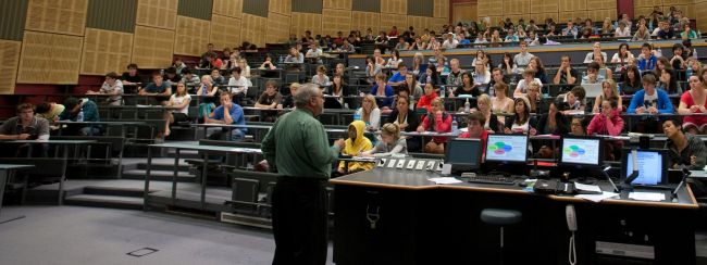 Teacher and students in a lecture theatre